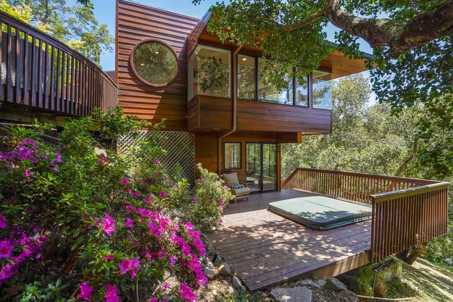 Timber deck and hot tub among flowering trees