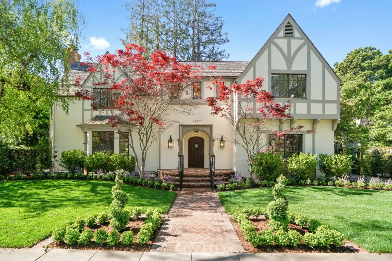 Tudor-style home with a formal front garden